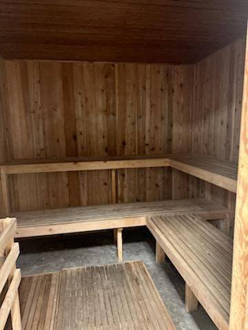 an empty wooden sauna with wooden benches